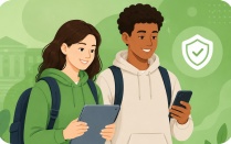 Two students look at their devices. 
