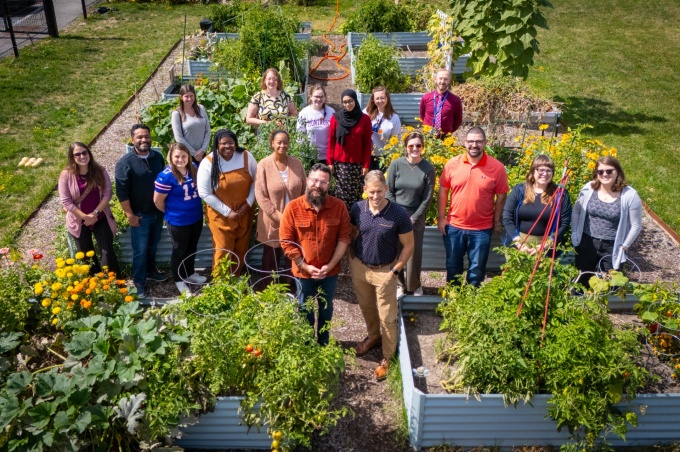 People standing in the campus garden. 