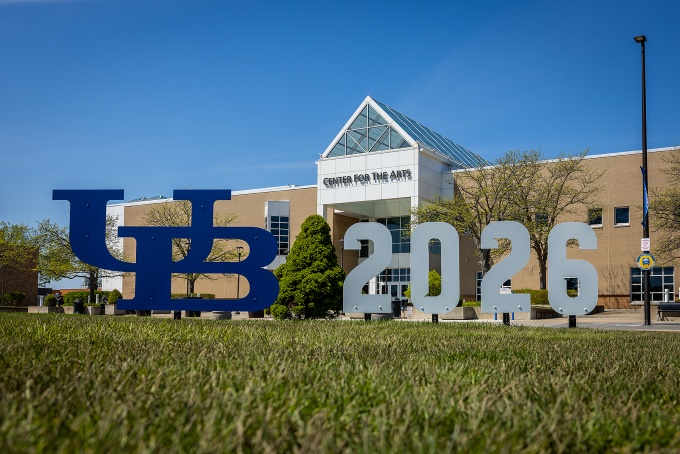 A UB 2026 selfie sign in front of the Center for the Arts. 