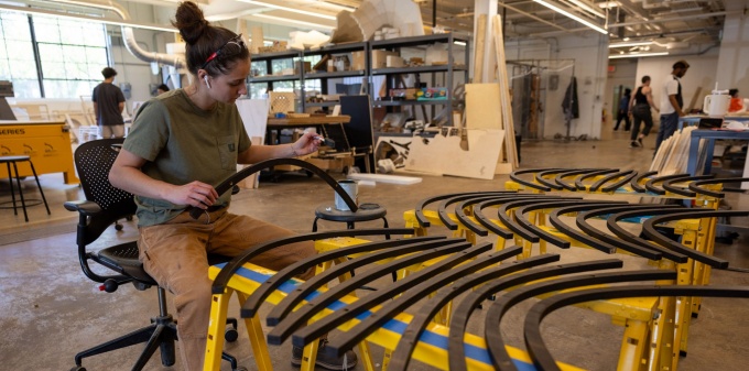 Architecture student working in the Fabrication Workshop on a piece of furniture. 