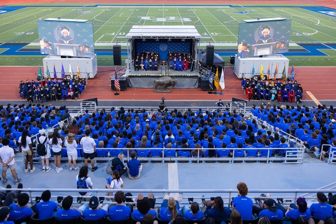 A view of the stage from the stands at Broadview Stadium during University Convocation. 