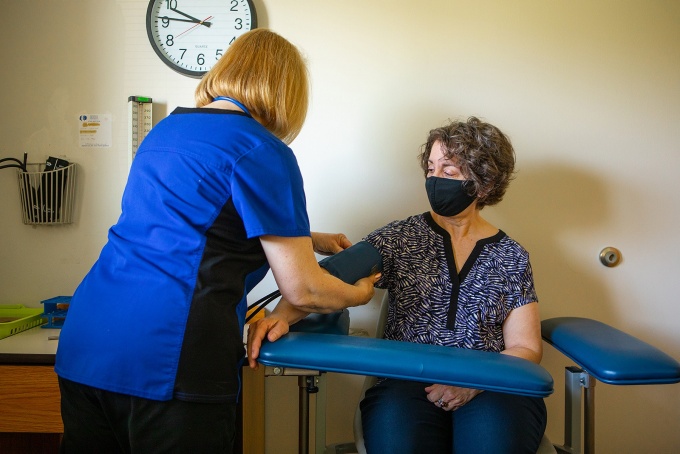 Woman having her blood pressure taken. 