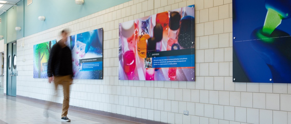 Hallway featuring chemistry themed posters. 