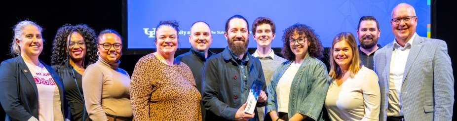 Student Life Marketing and Communications team on a stage. 