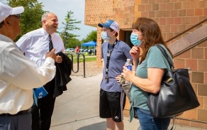 President Satish Tripathi and VP Brian Hamluk greet students and their parents during move-in weekend. 