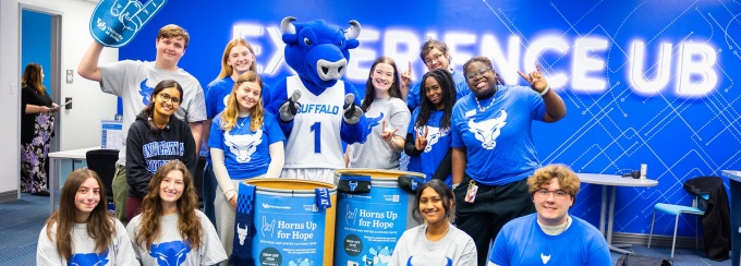 Students are photographed around collection bins for “Horns Up for Hope,” a monthlong food and winter clothing drive supporting local community members in need, in November 2025 in the Student Engagement office space in the Student Union. 