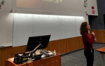 Dr. Corey Seemiller presenting inside a UB lecture hall. 