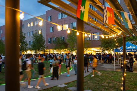 Students gathered in Greiner courtyard at night. 