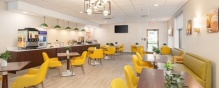The breakfast room at the Comfort Inn & Suites Buffalo Airport. 