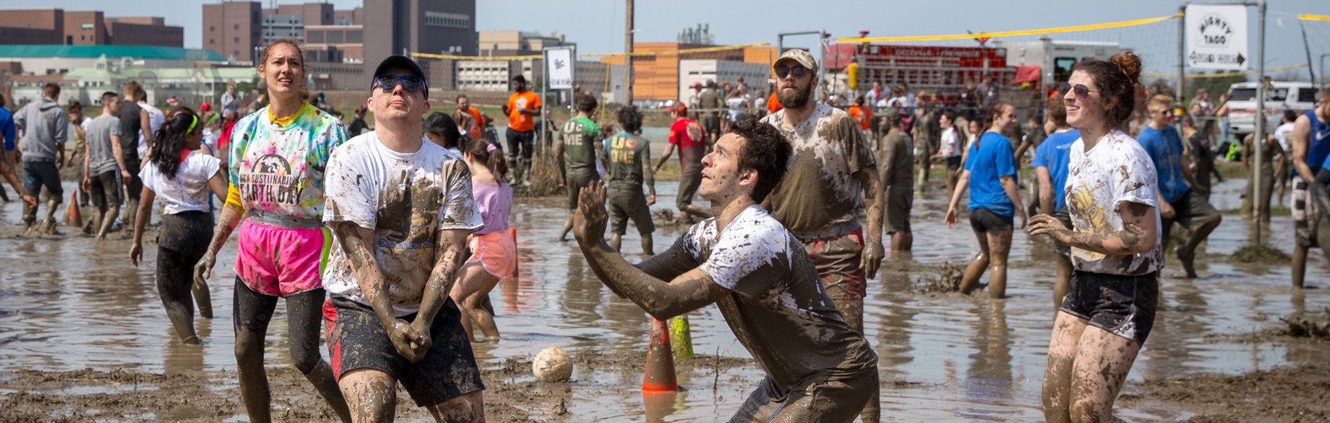students playing mud volleyball during Oozefest. 