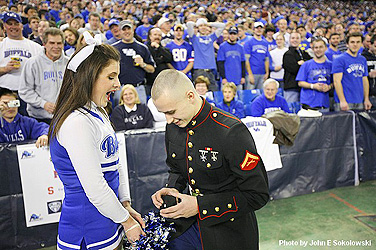 Marine Lance Corporal Mike Neisen surprised his girlfriend, UB cheerleader Eve Solomon, with a marriage proposal. She accepted. Photo: JOHN SOKOLOWSKI